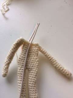 inserting wire into crochet doll