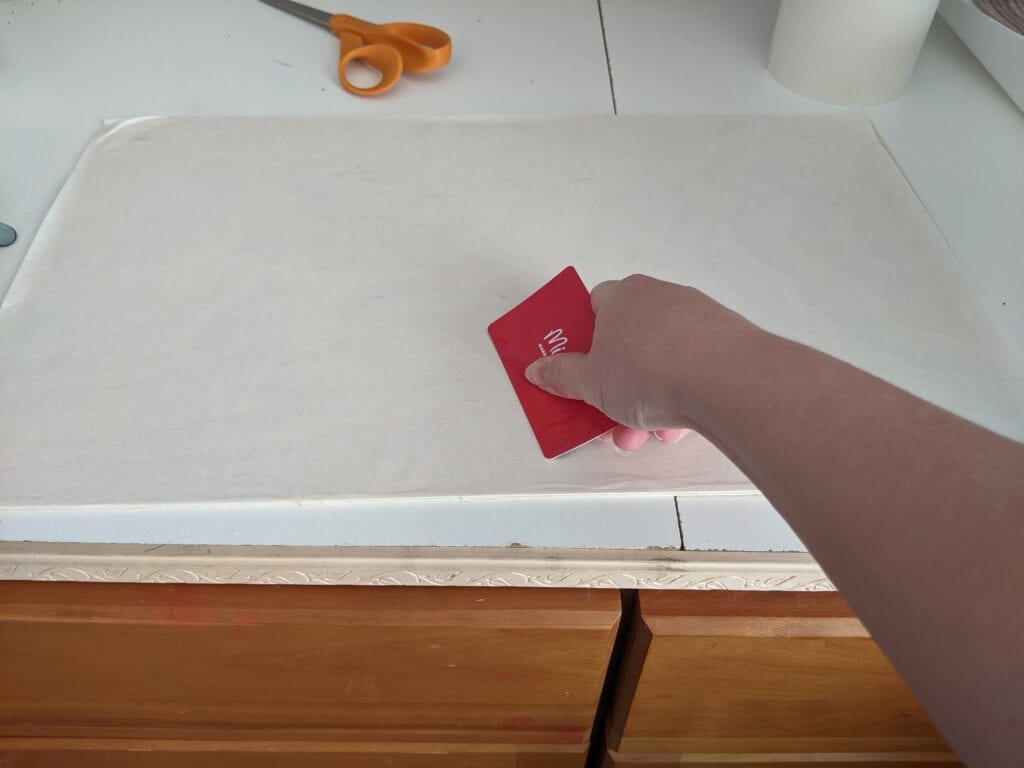 press down the masking with a credit card